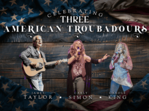 Three artists behind a wood backdrop performing 