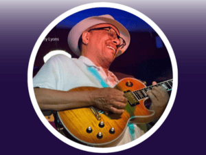 Image of Chuck Lambert playing his guitar